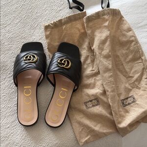 Gucci Black Slides with Gold Logo
